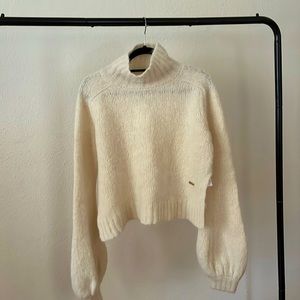 JW Anderson ivory knit turtleneck sweater